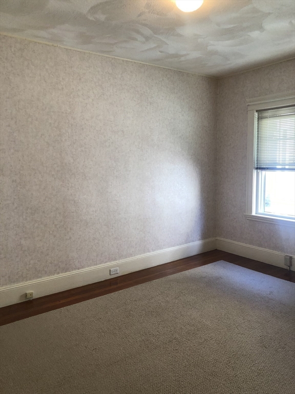 64 Freeman Street, Unit 1 Arlington, MA 02474 - Photo 9 of 9 a view of an empty room and window