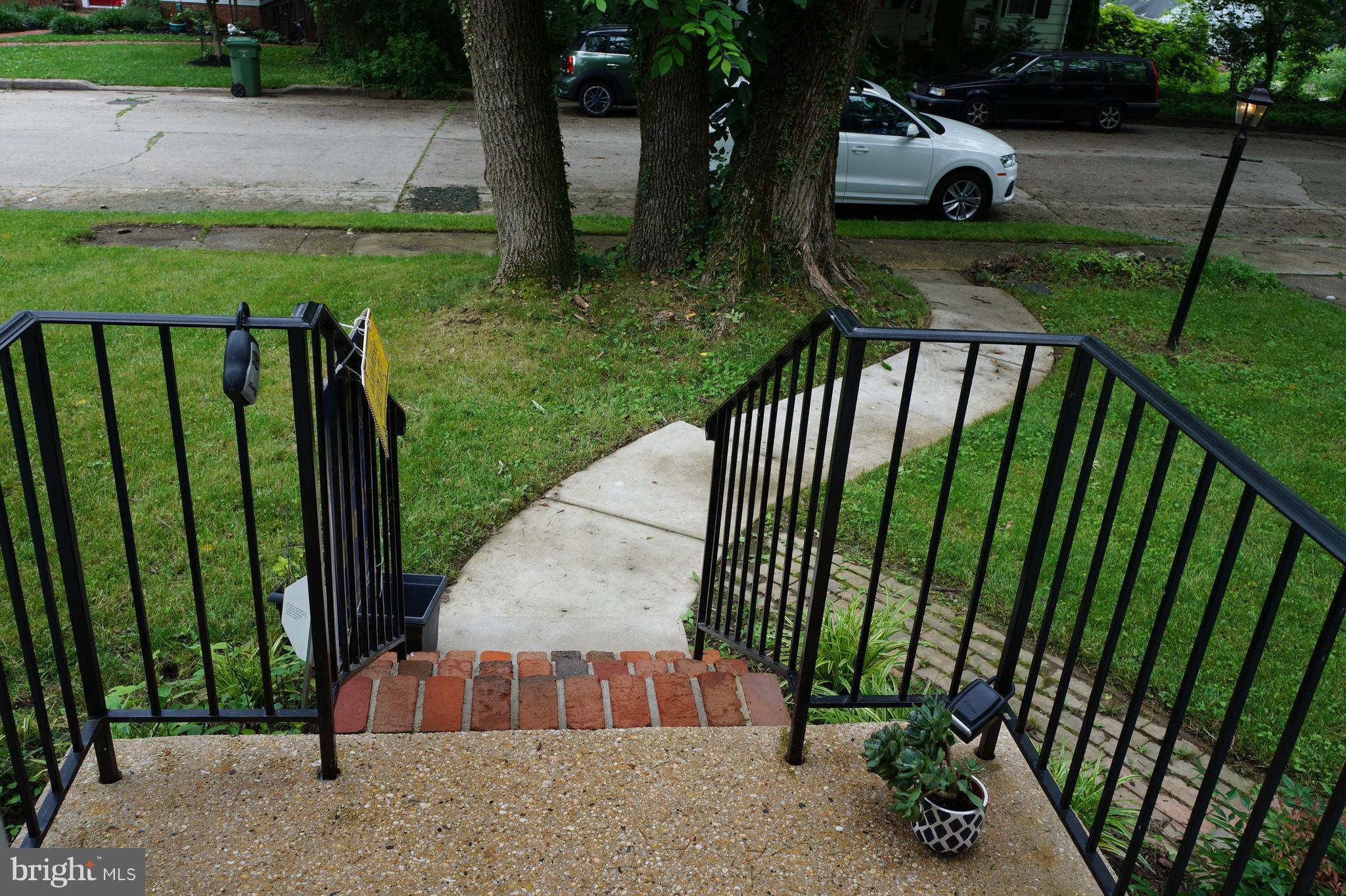 2302 Pickwick Road Baltimore, MD 21207 - Photo 4 of 30 Porch with iron rails & brick steps