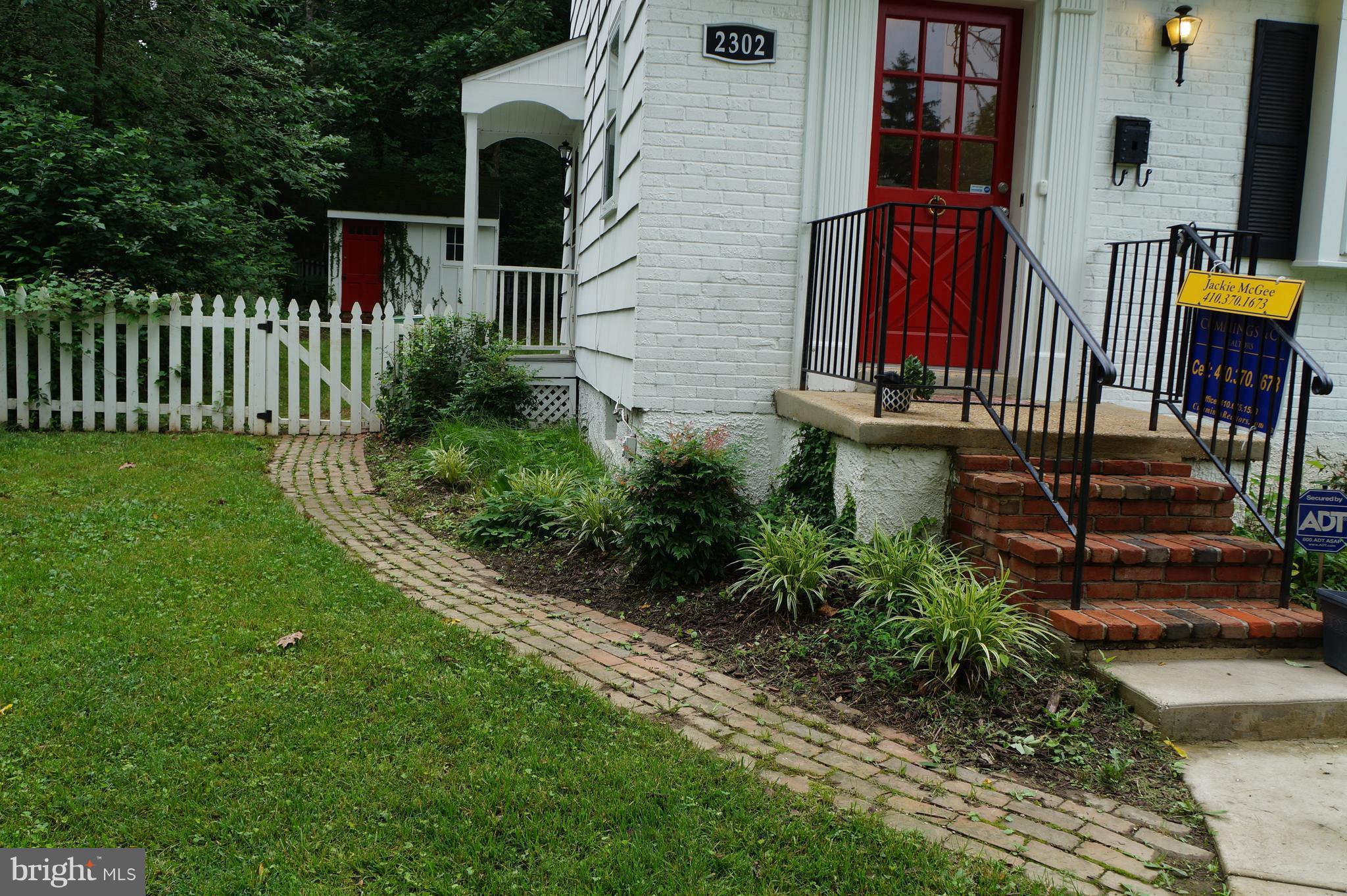 2302 Pickwick Road Baltimore, MD 21207 - Photo 5 of 30 Charming brick pathway to rear yard