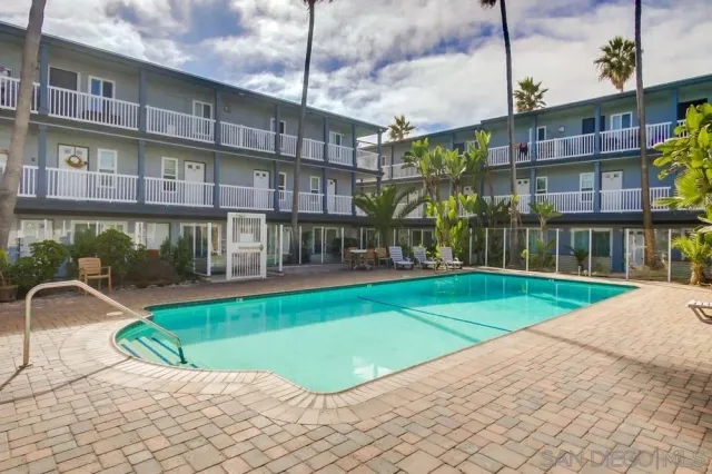 a view of a building with a swimming pool