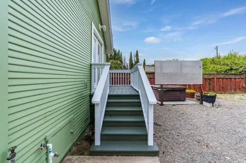 a front view of house with a garden