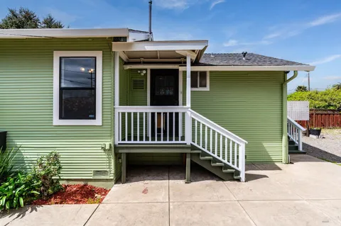 a house with trees in front of it
