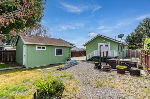 a house view with a backyard space