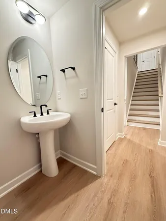 a bathroom with a sink and mirror