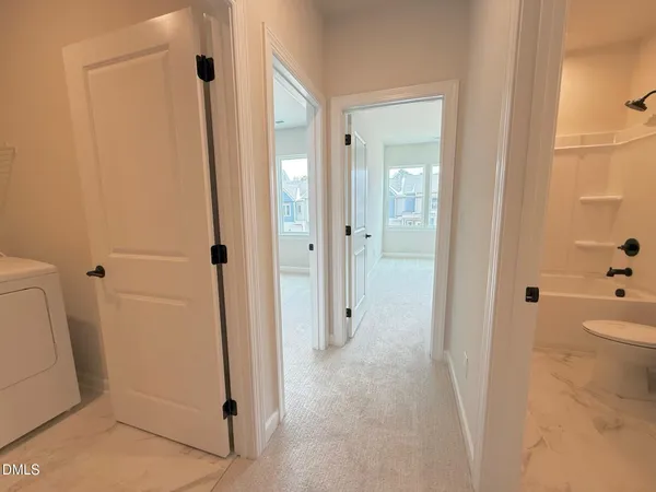 a bathroom with a tub and shower