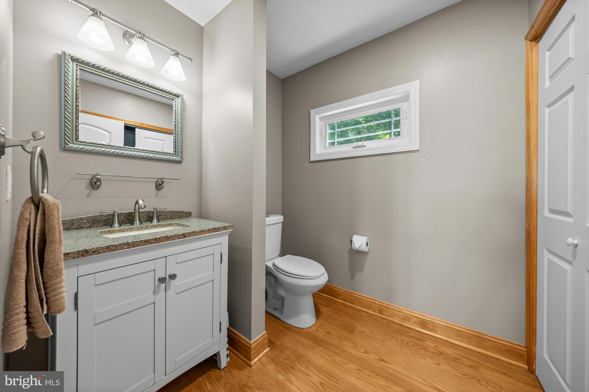 1 Risner Avenue Penns Grove, NJ 08069 - Photo 19 of 45 a bathroom with a granite countertop toilet sink and mirror