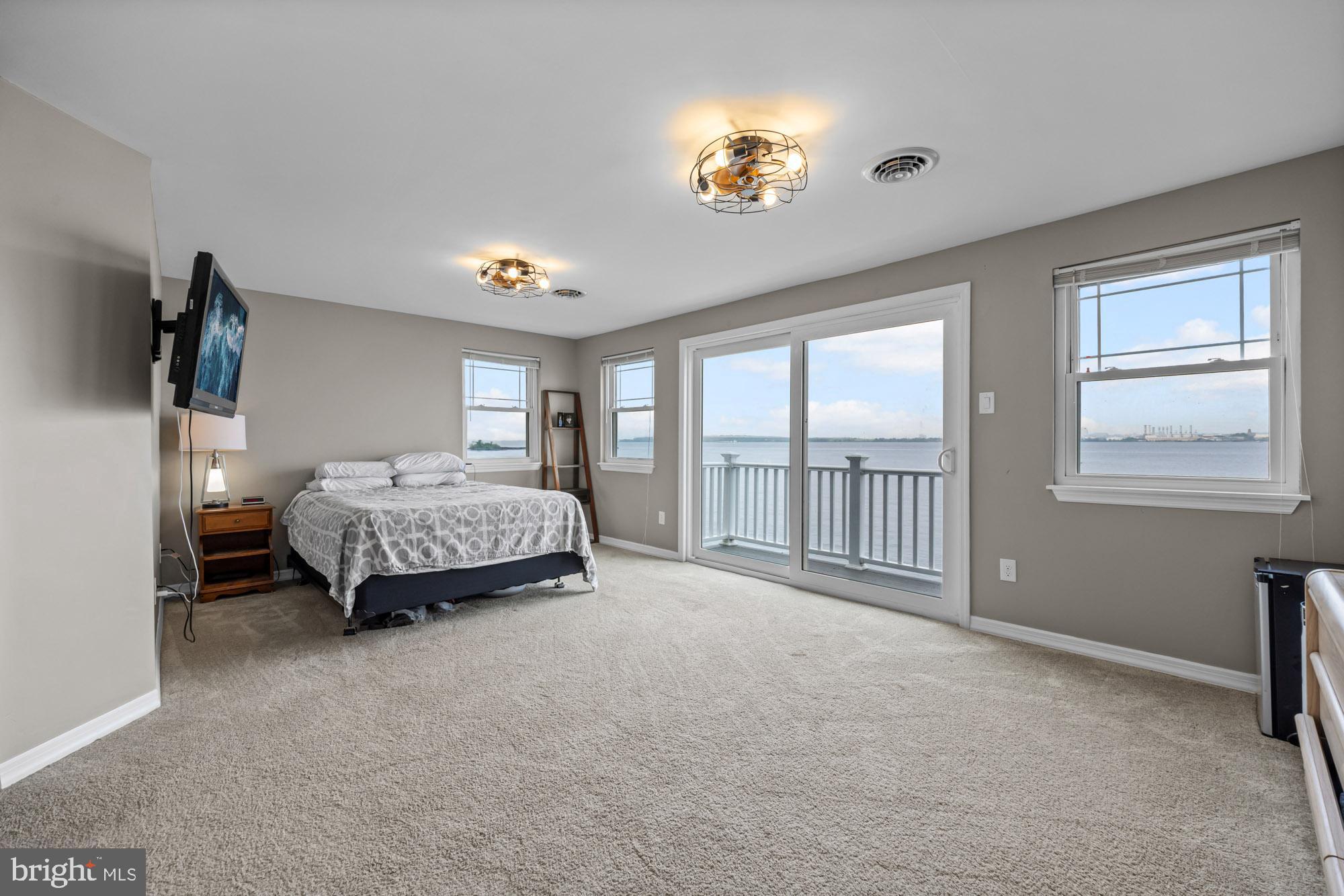 1 Risner Avenue Penns Grove, NJ 08069 - Photo 21 of 45 a spacious bedroom with a bed and large windows