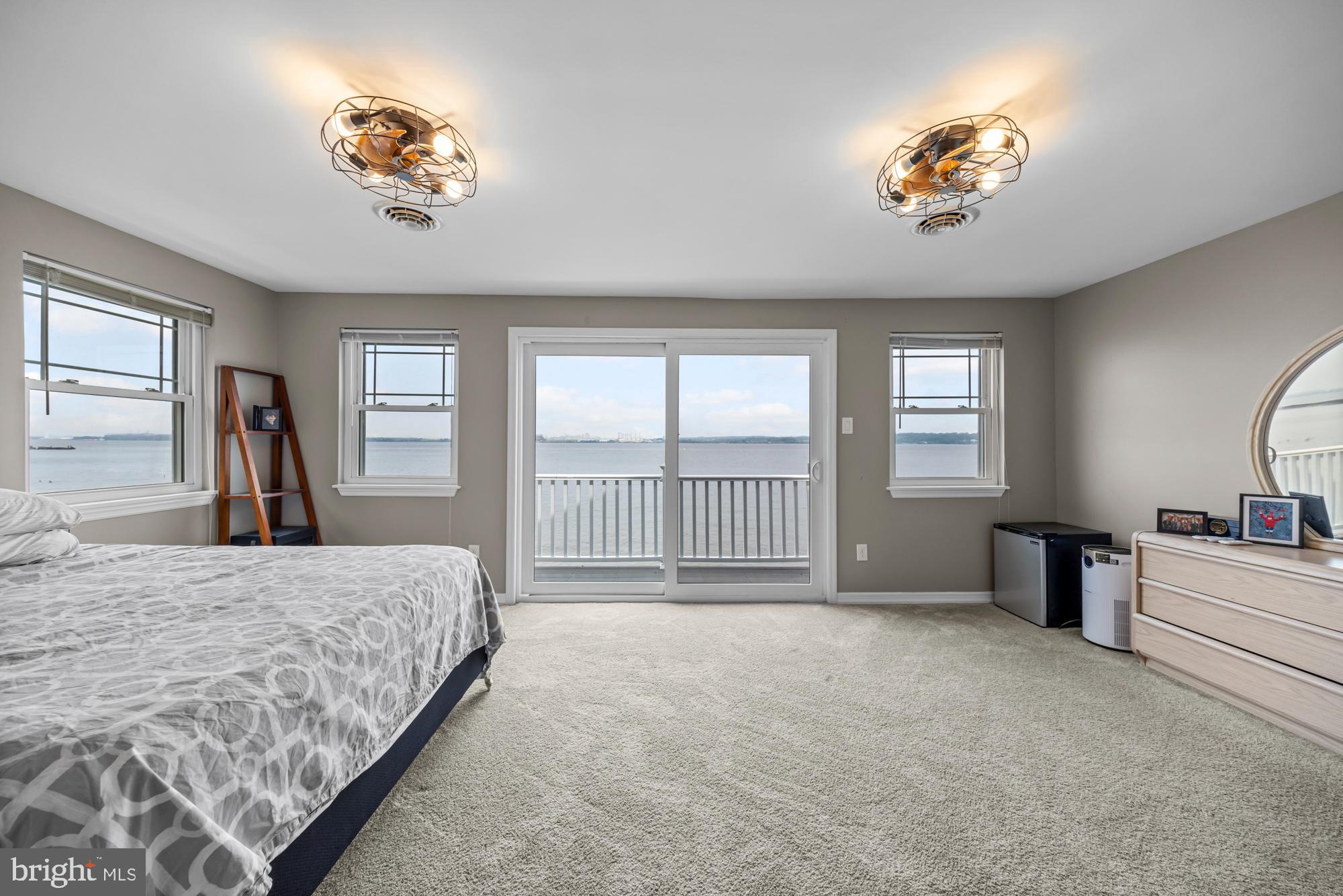 1 Risner Avenue Penns Grove, NJ 08069 - Photo 24 of 45 a spacious bedroom with a bed and a chandelier