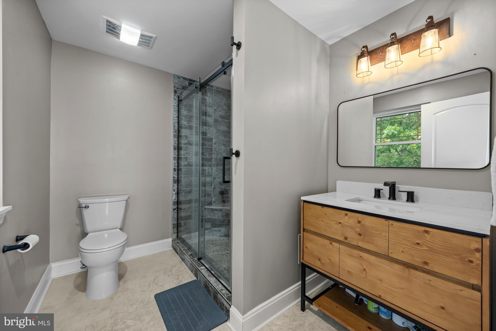1 Risner Avenue Penns Grove, NJ 08069 - Photo 26 of 45 a bathroom with a toilet a sink and mirror