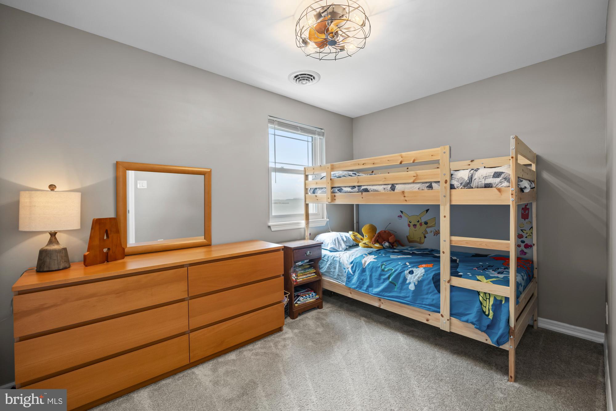 1 Risner Avenue Penns Grove, NJ 08069 - Photo 29 of 45 a bedroom with a bed and a chandelier