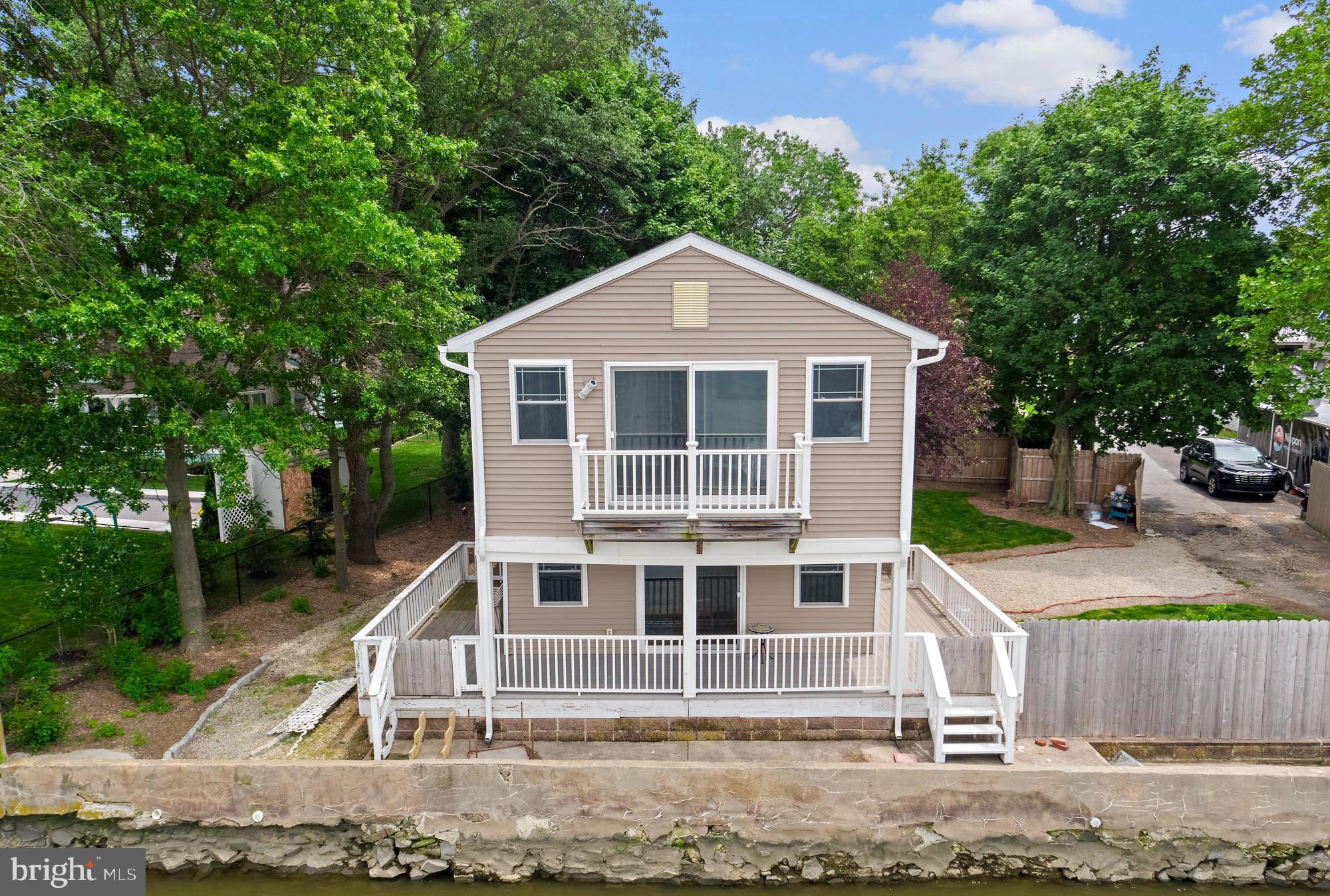 1 Risner Avenue Penns Grove, NJ 08069 - Photo 3 of 45 a front view of a house with a yard