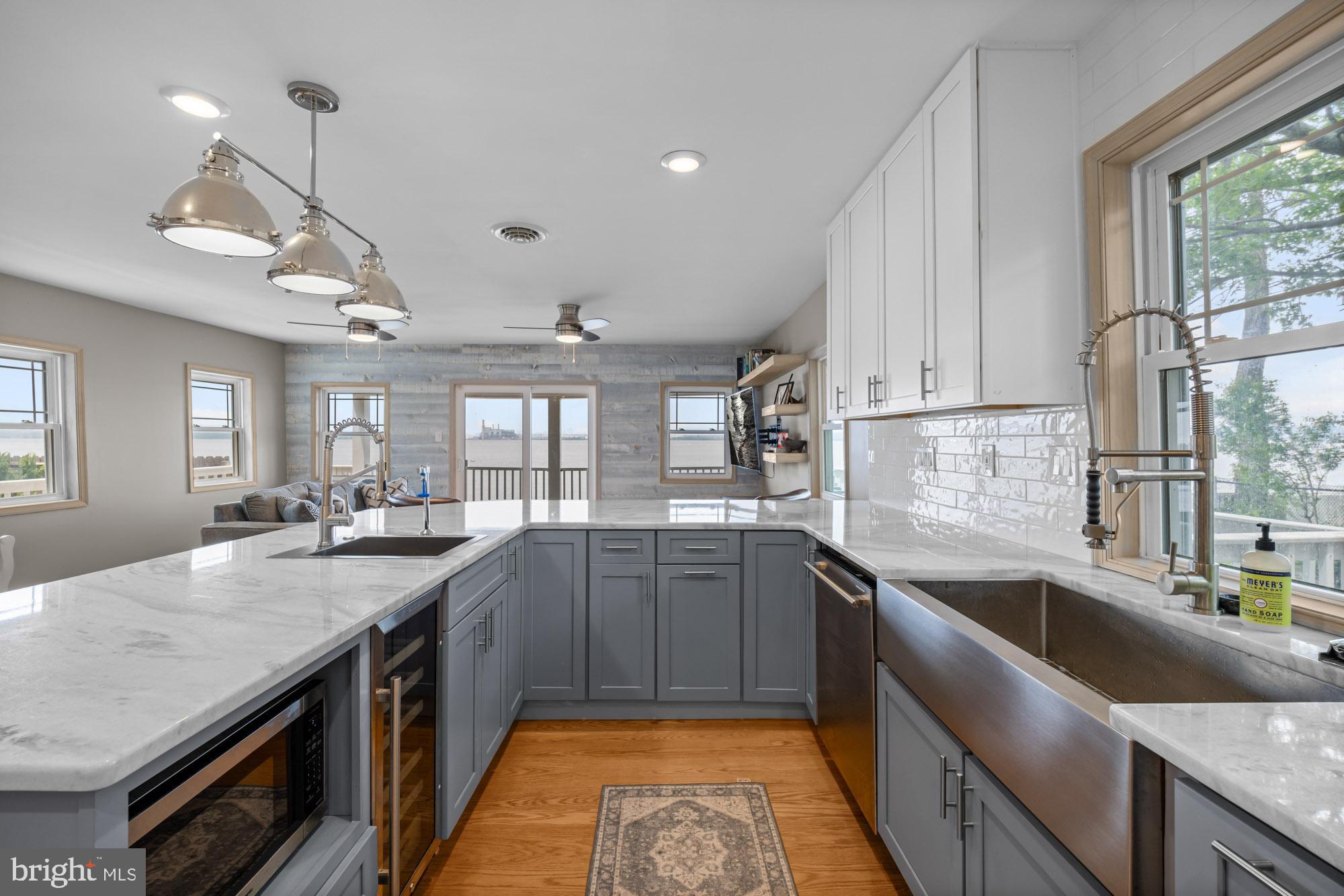 1 Risner Avenue Penns Grove, NJ 08069 - Photo 10 of 45 a kitchen with stainless steel appliances granite countertop a sink counter space cabinets and a window