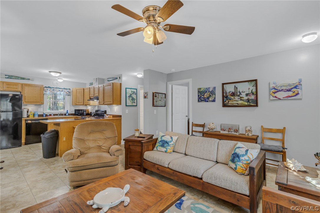 79 Lucom Point Drive Reedville, VA 22539 - Photo 20 of 32 a living room with furniture and kitchen view