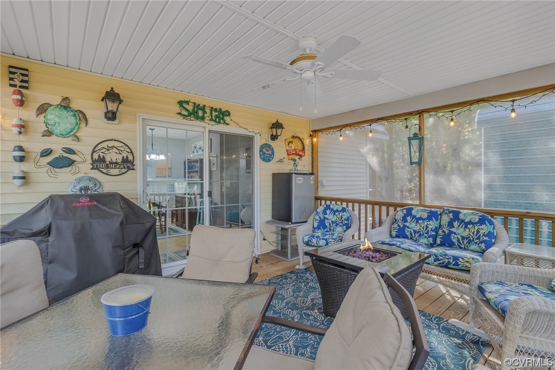 79 Lucom Point Drive Reedville, VA 22539 - Photo 23 of 32 a living room with furniture and a large window