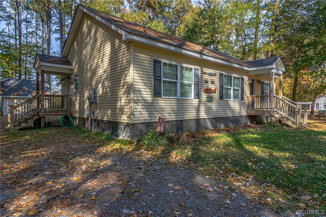 79 Lucom Point Drive Reedville, VA 22539 - Photo 8 of 32 a front view of house with yard
