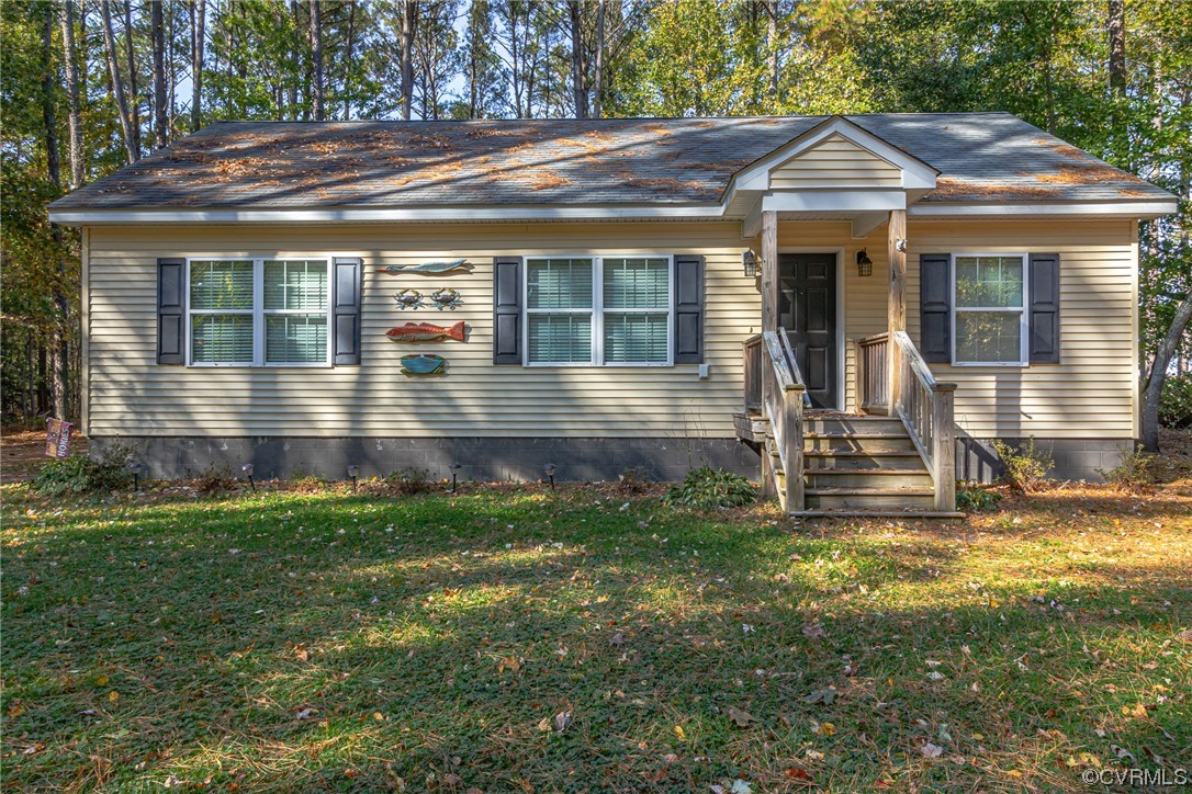 79 Lucom Point Drive Reedville, VA 22539 - Photo 9 of 32 a front view of house with yard