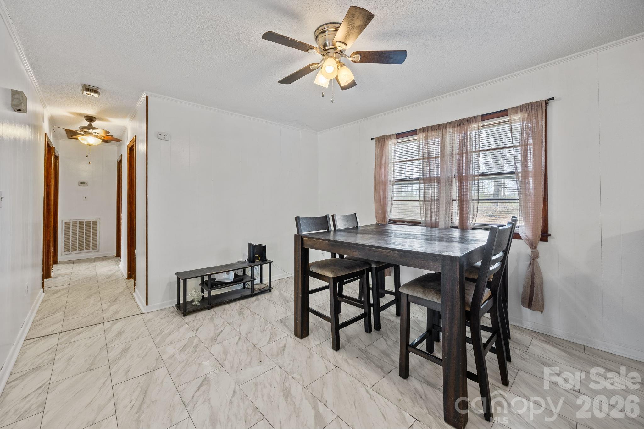 289 Washington Park Road Mount Gilead, NC 27306 - Photo 27 of 39 a view of a dining room with furniture