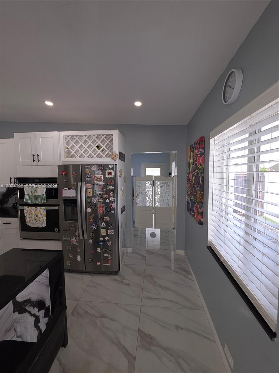 651 East 48th Street Hialeah, FL 33013 - Photo 20 of 52 a open kitchen with a large window
