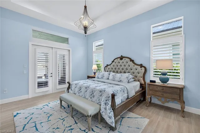 a bedroom with a bed and a couch