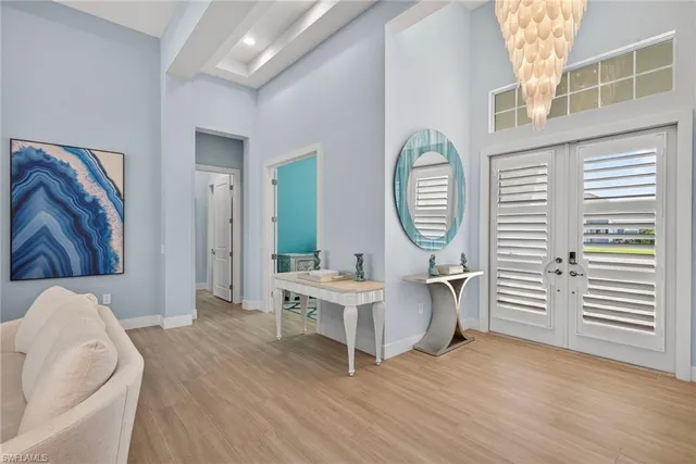 a view of a livingroom with furniture wooden floor and a window