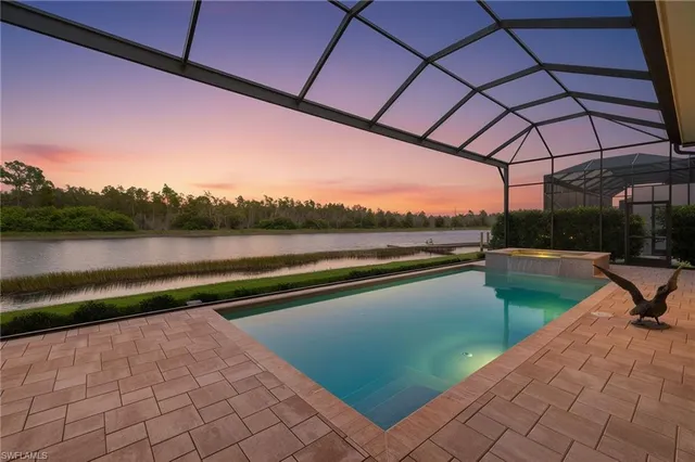 a view of swimming pool with outdoor seating and yard