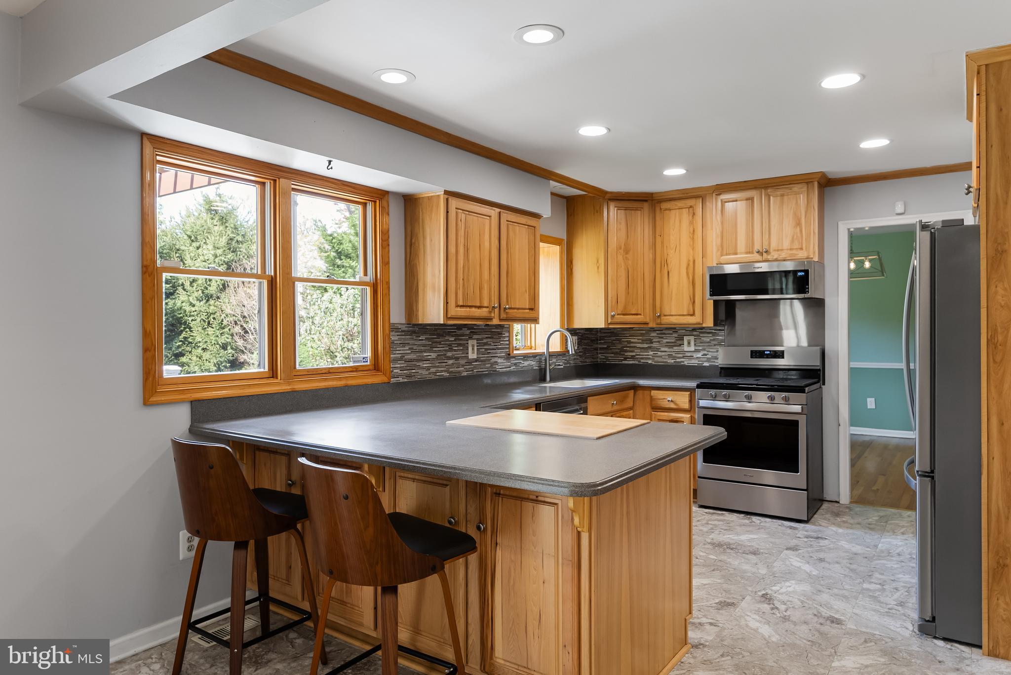 10 Mindy Drive Moorestown, NJ 08057 - Photo 12 of 29 a kitchen with a stove a sink a microwave and a refrigerator
