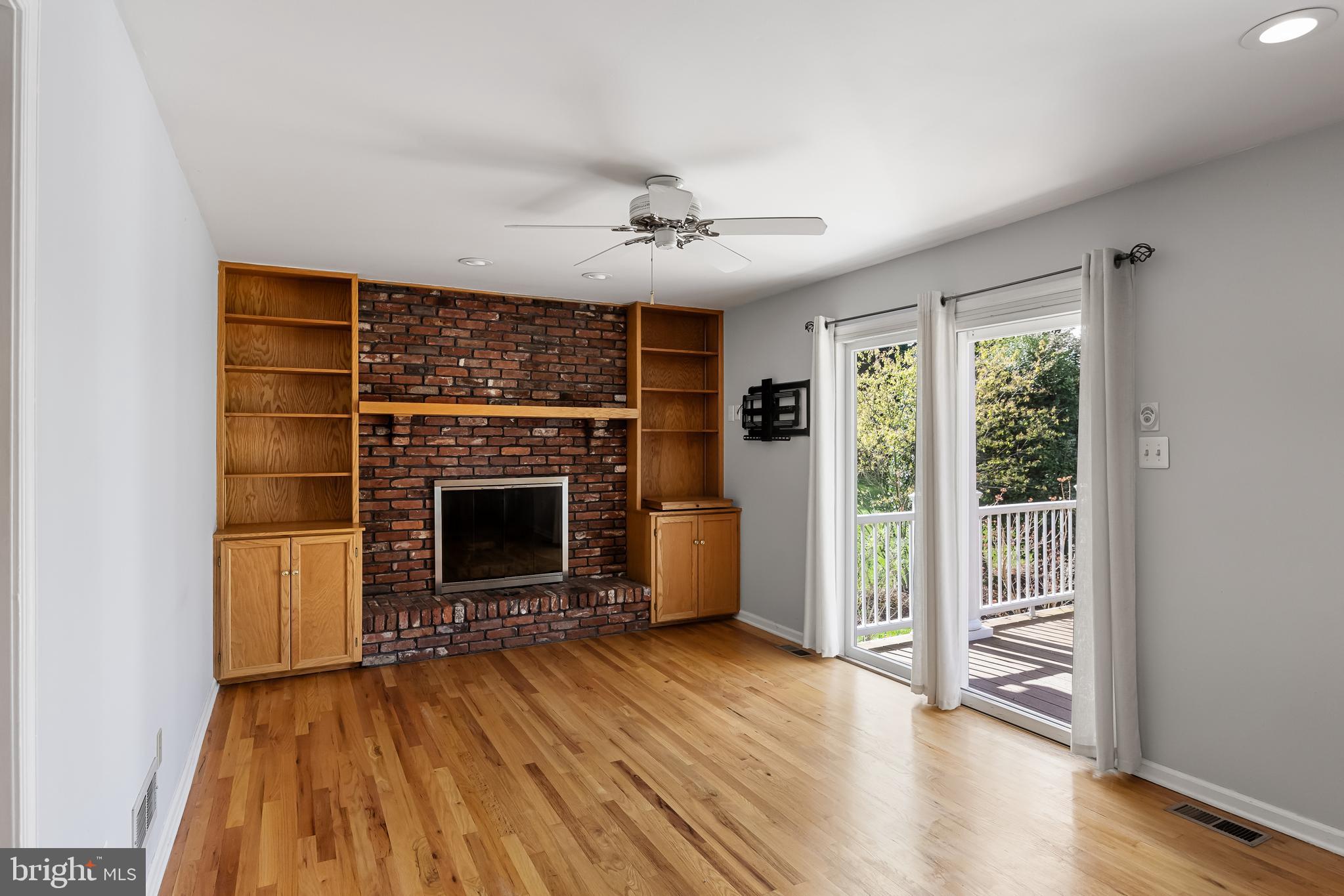 10 Mindy Drive Moorestown, NJ 08057 - Photo 15 of 29 wooden floor fireplace and windows in an empty room
