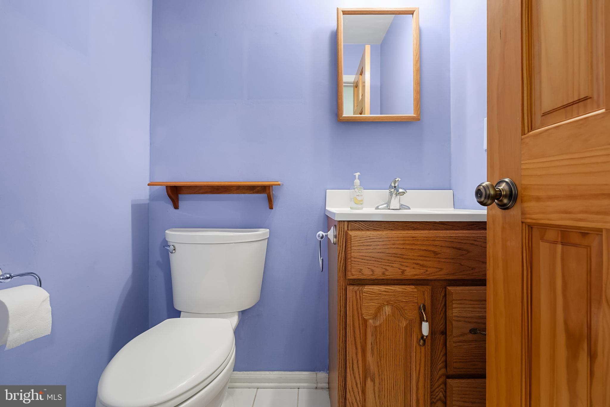 10 Mindy Drive Moorestown, NJ 08057 - Photo 17 of 29 a bathroom with a toilet sink vanity and mirror
