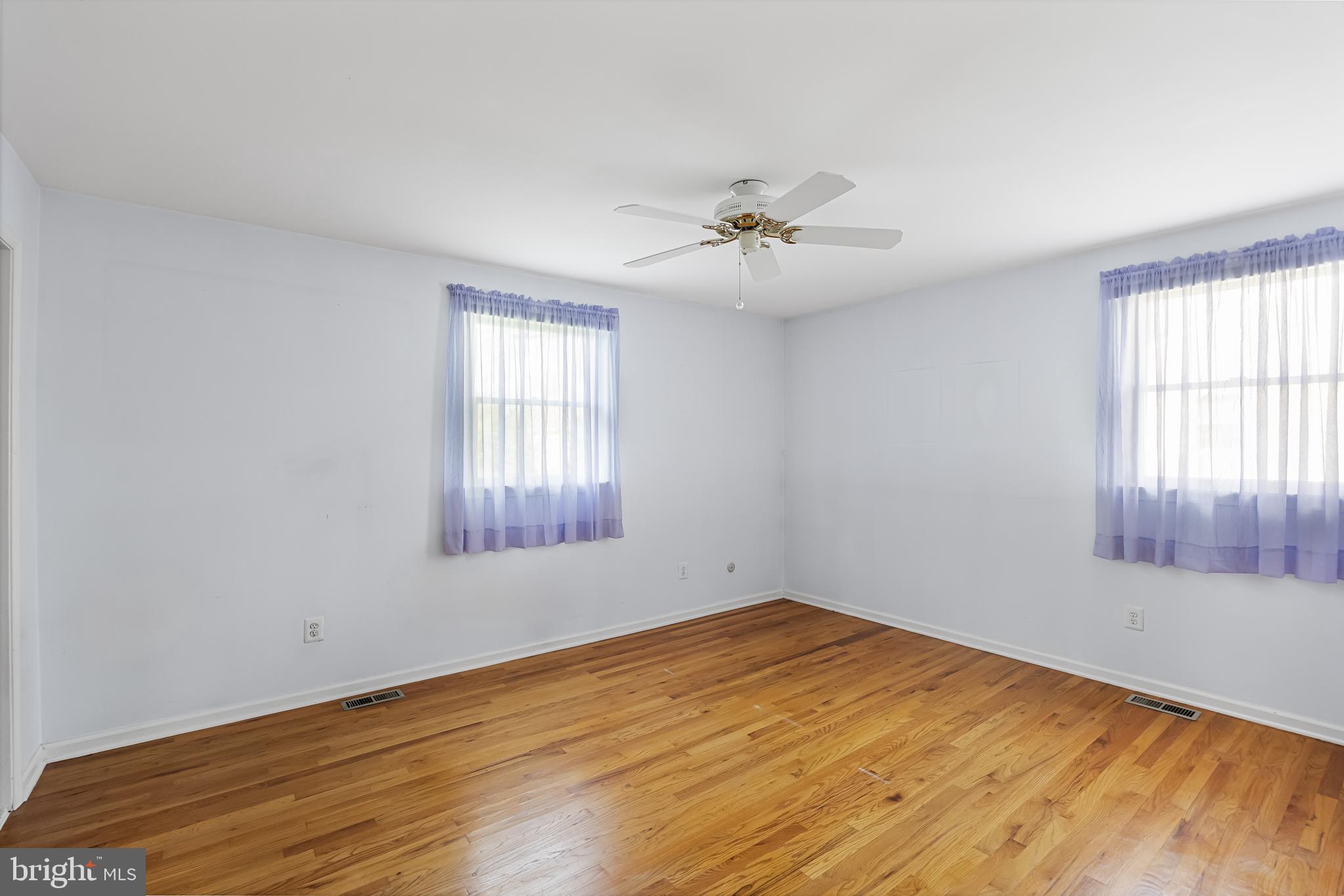 10 Mindy Drive Moorestown, NJ 08057 - Photo 18 of 29 a view of empty room with wooden floor and fan