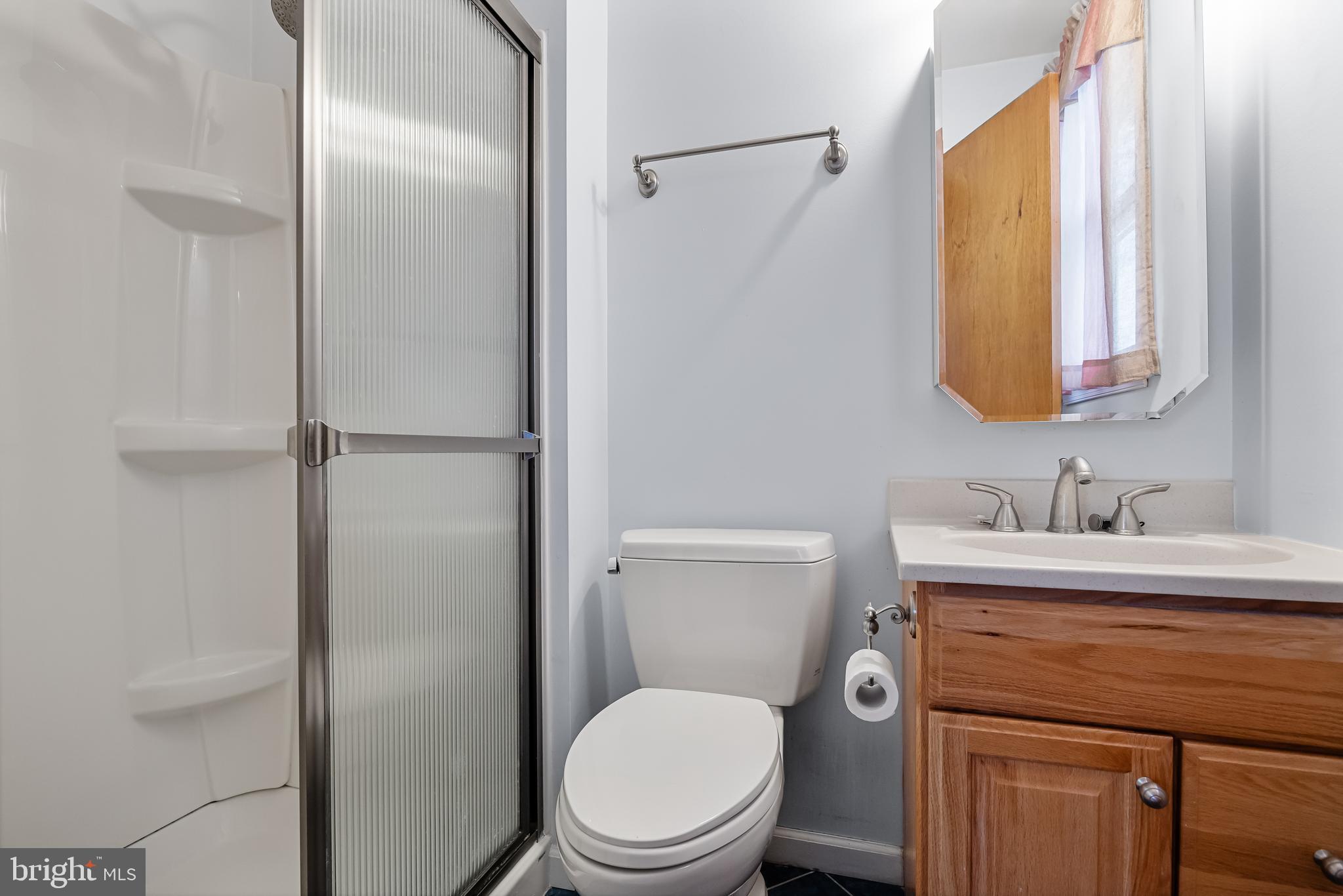 10 Mindy Drive Moorestown, NJ 08057 - Photo 21 of 29 a bathroom with a granite countertop toilet sink and mirror