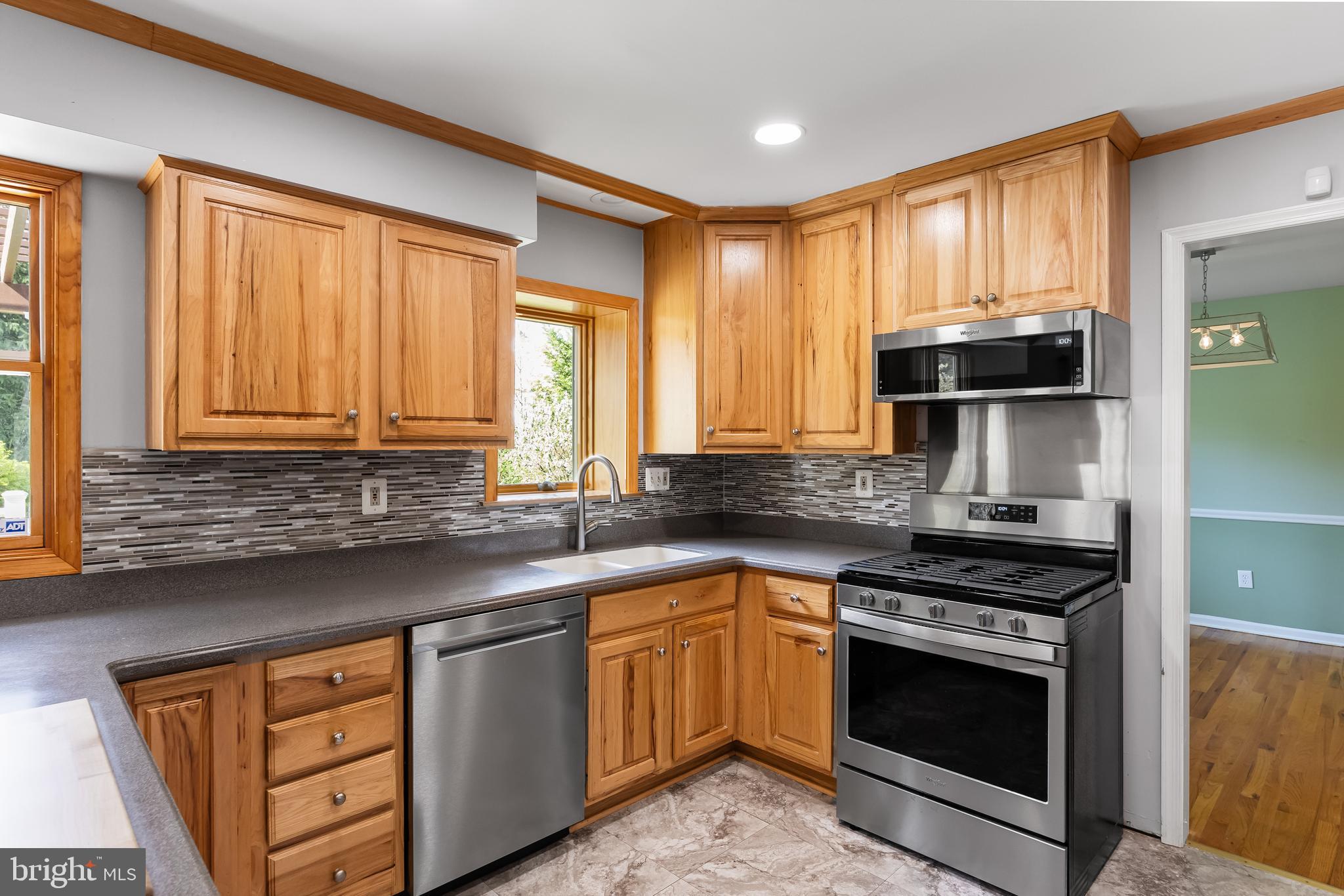 10 Mindy Drive Moorestown, NJ 08057 - Photo 10 of 29 a kitchen with stainless steel appliances a stove sink and cabinets