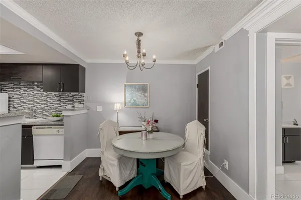 a bathroom with a sink stainless steel appliances and cabinets