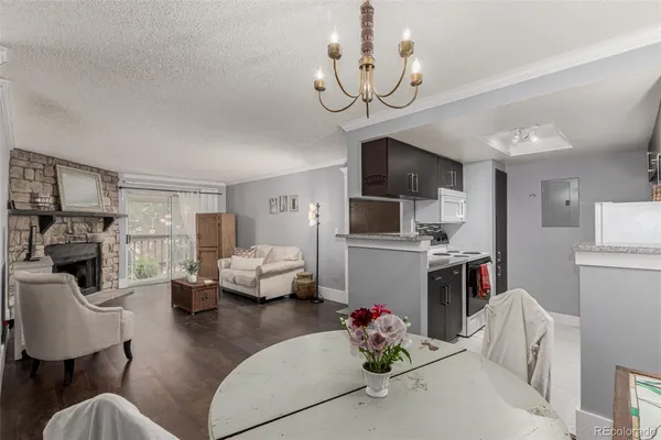 a living room with fireplace furniture and a flat screen tv