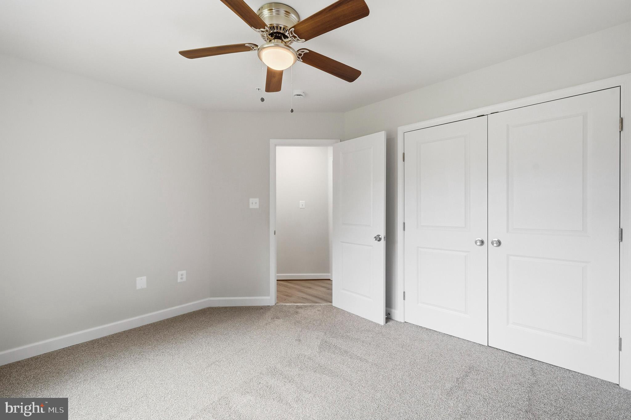 29725 Bruce Road Mechanicsville, MD 20659 - Photo 68 of 79 an empty room with closet and a chandelier fan