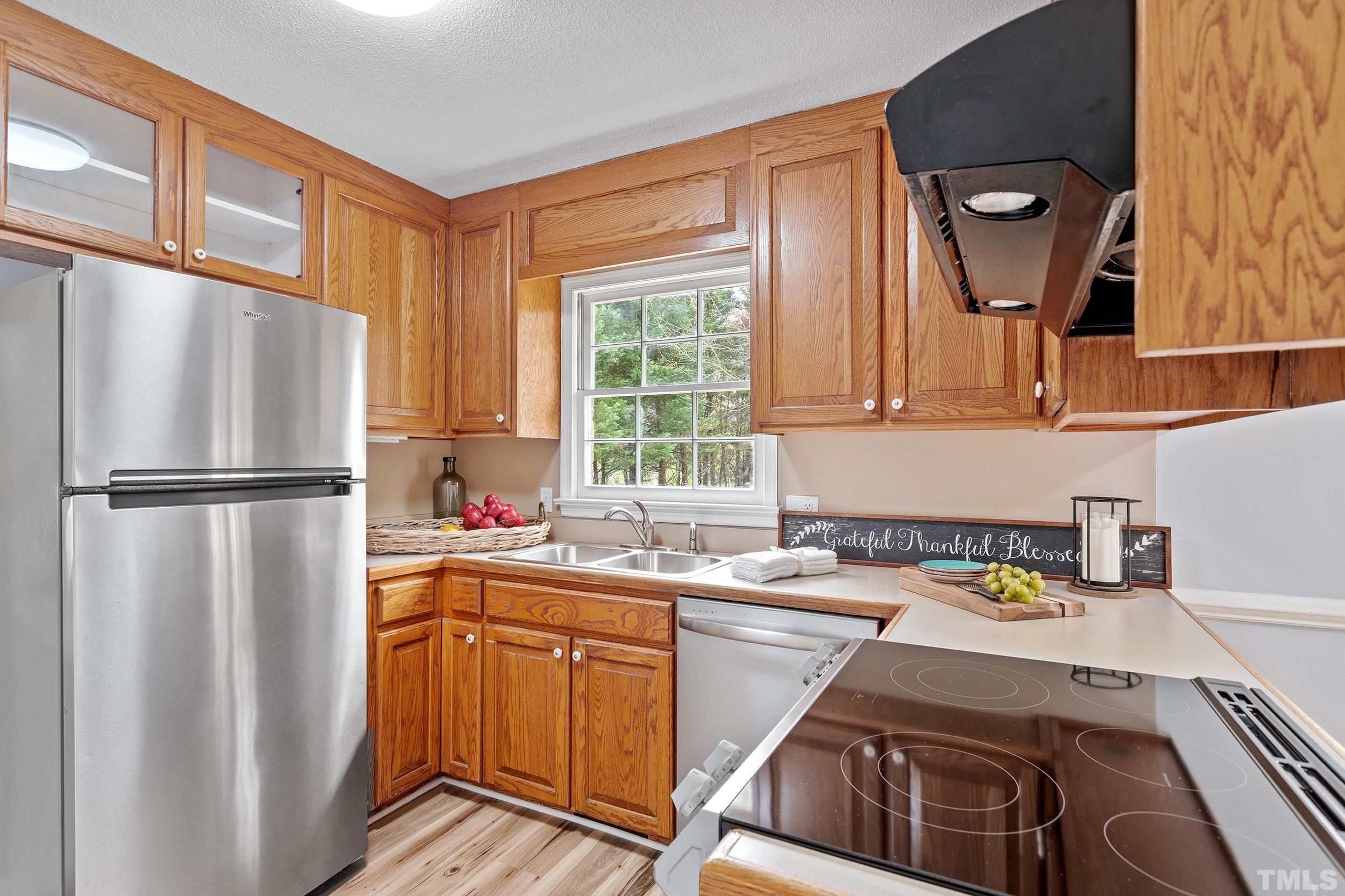 4108 Willow Oak Road Raleigh, NC 27604 - Photo 16 of 35 a kitchen with a sink appliances and cabinets