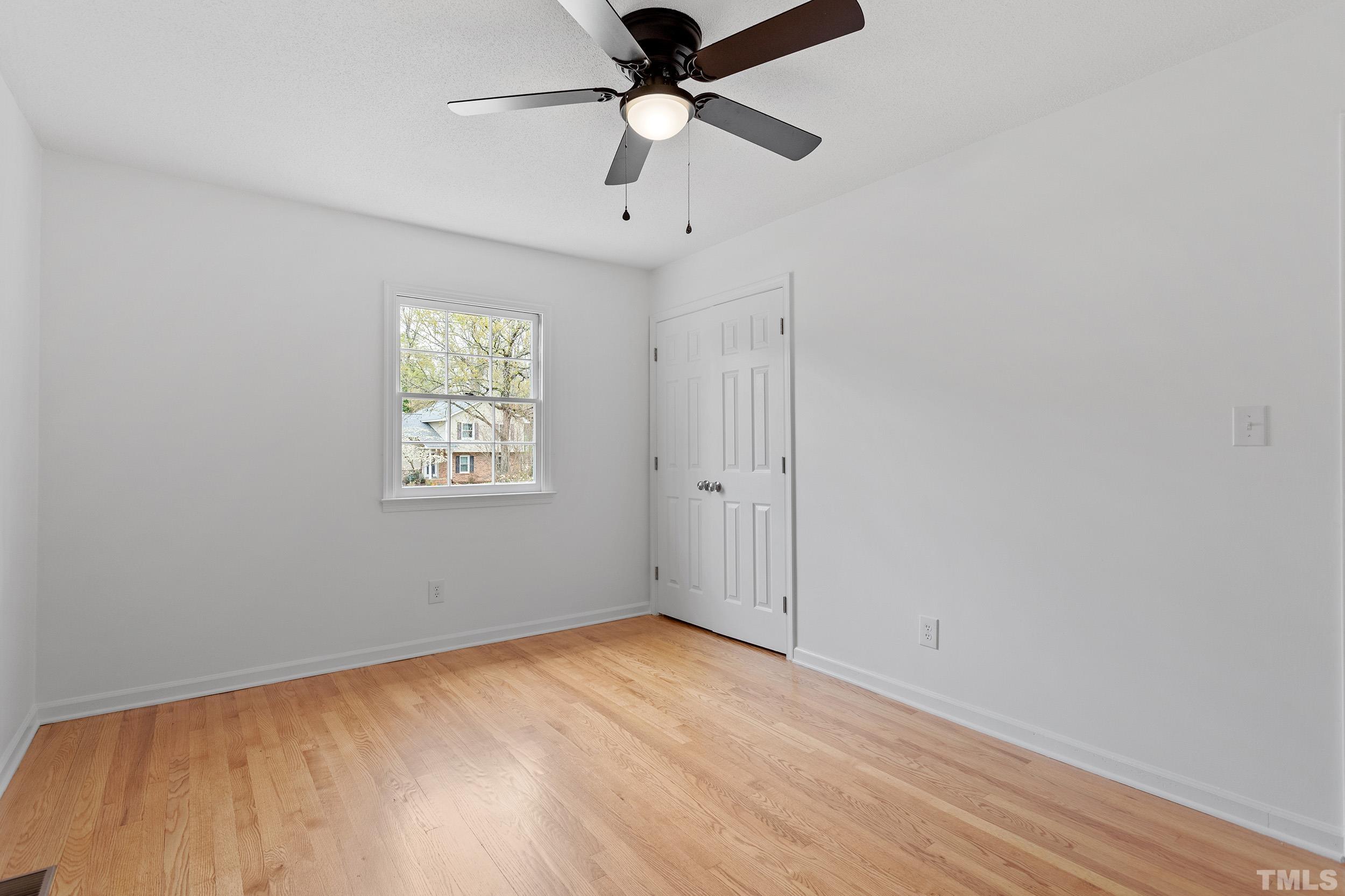 4108 Willow Oak Road Raleigh, NC 27604 - Photo 19 of 35 an empty room with a window and a fan