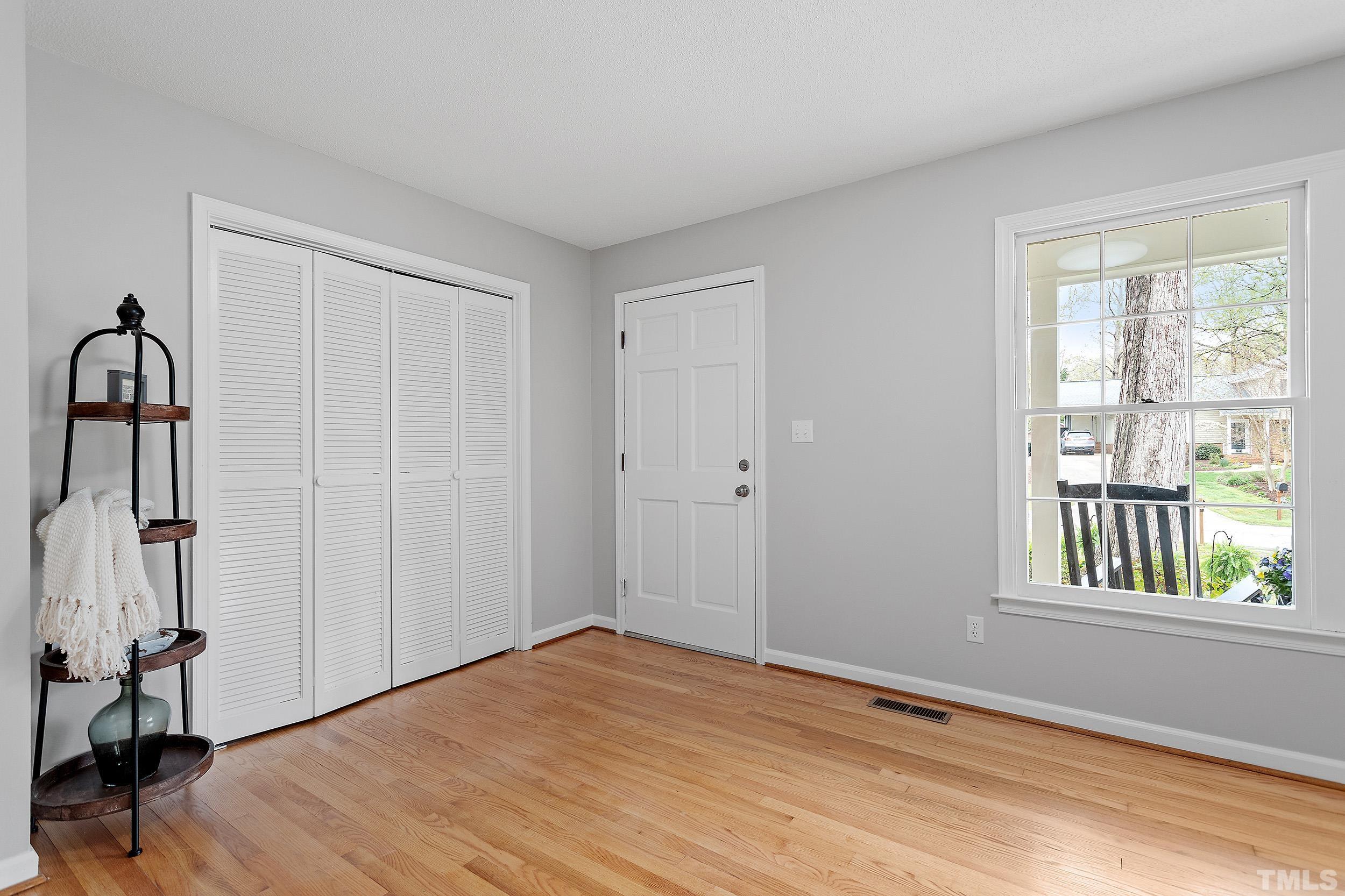 4108 Willow Oak Road Raleigh, NC 27604 - Photo 8 of 35 a view of empty room with wooden floor and fan