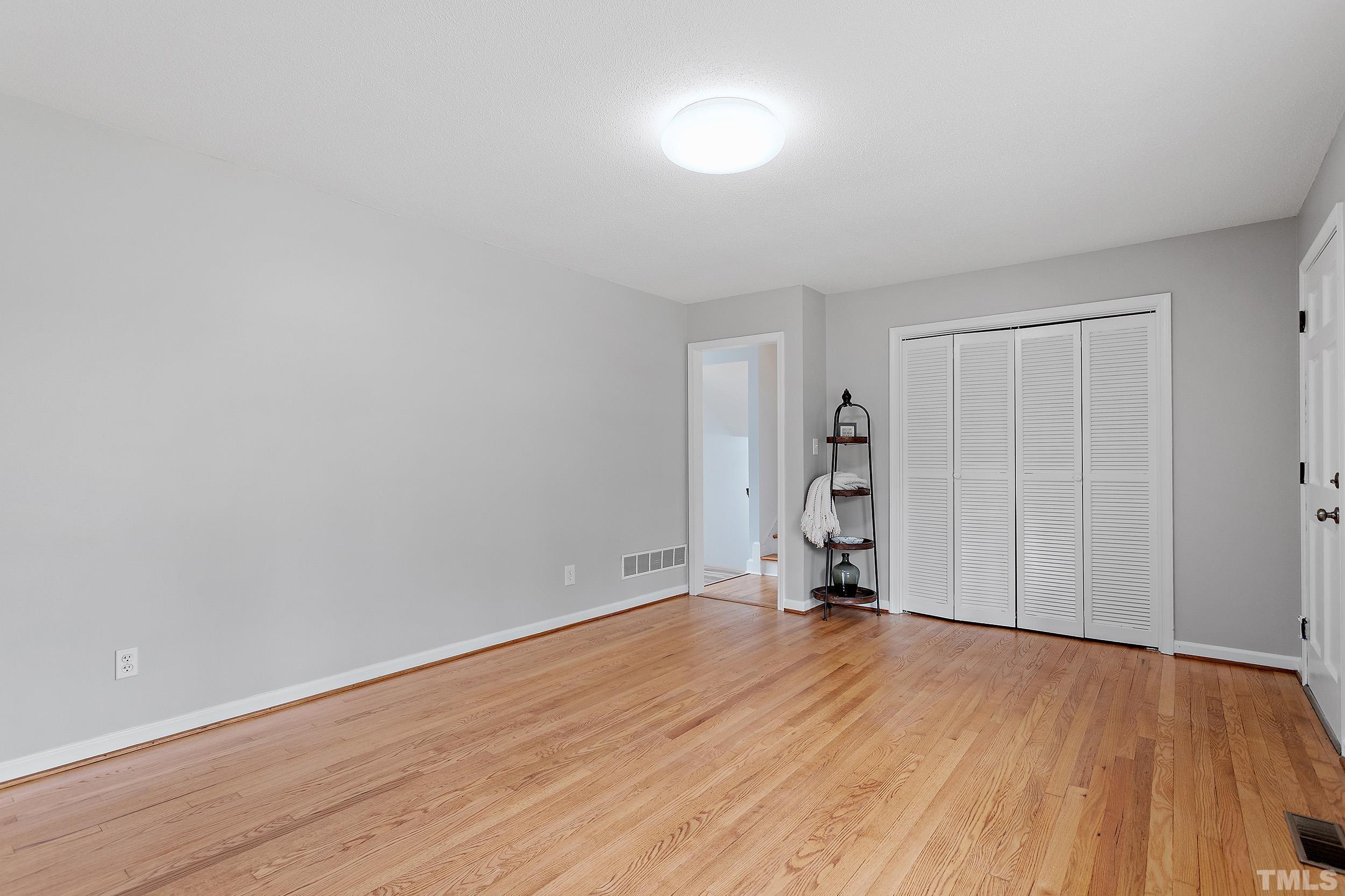 4108 Willow Oak Road Raleigh, NC 27604 - Photo 9 of 35 a view of empty room with wooden floor and window