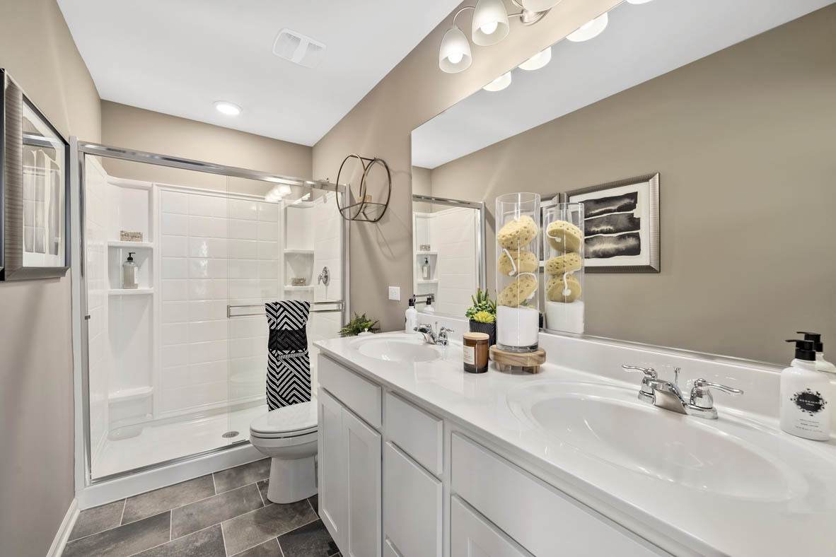 3732 Bailey Road Yorkville, IL 60560 - Photo 12 of 20 a bathroom with a double vanity sink toilet mirror and shower