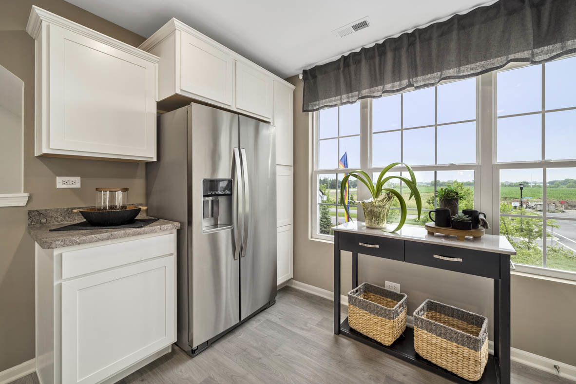 3732 Bailey Road Yorkville, IL 60560 - Photo 3 of 20 a kitchen with stainless steel appliances a sink a refrigerator and a window
