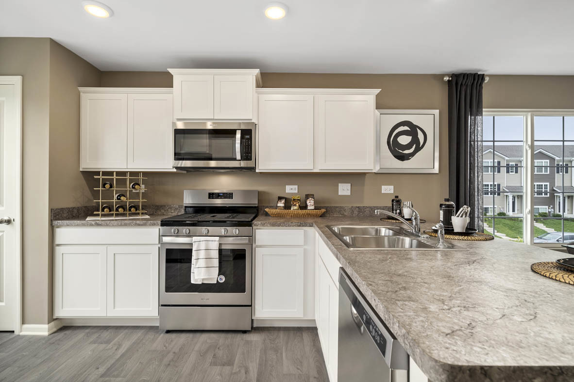 3732 Bailey Road Yorkville, IL 60560 - Photo 5 of 20 a kitchen with a stove and a microwave