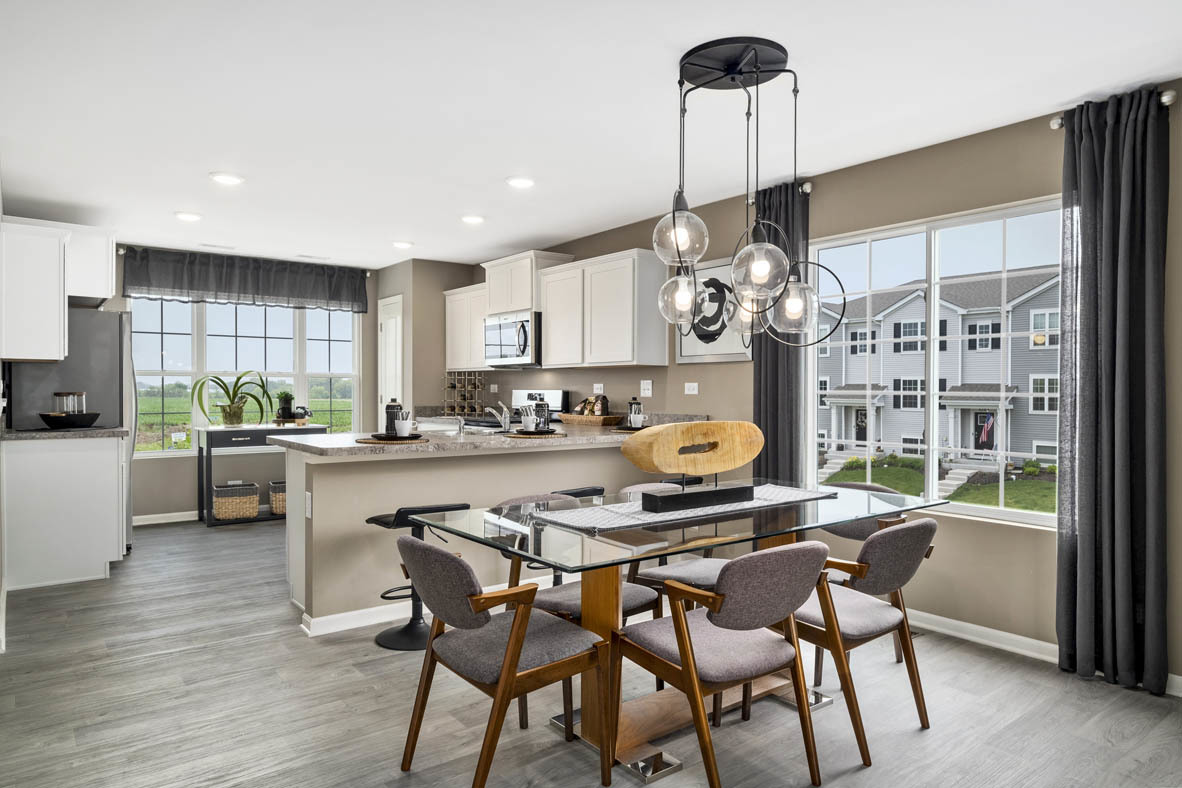 3732 Bailey Road Yorkville, IL 60560 - Photo 7 of 20 a kitchen with a dining table chairs and refrigerator
