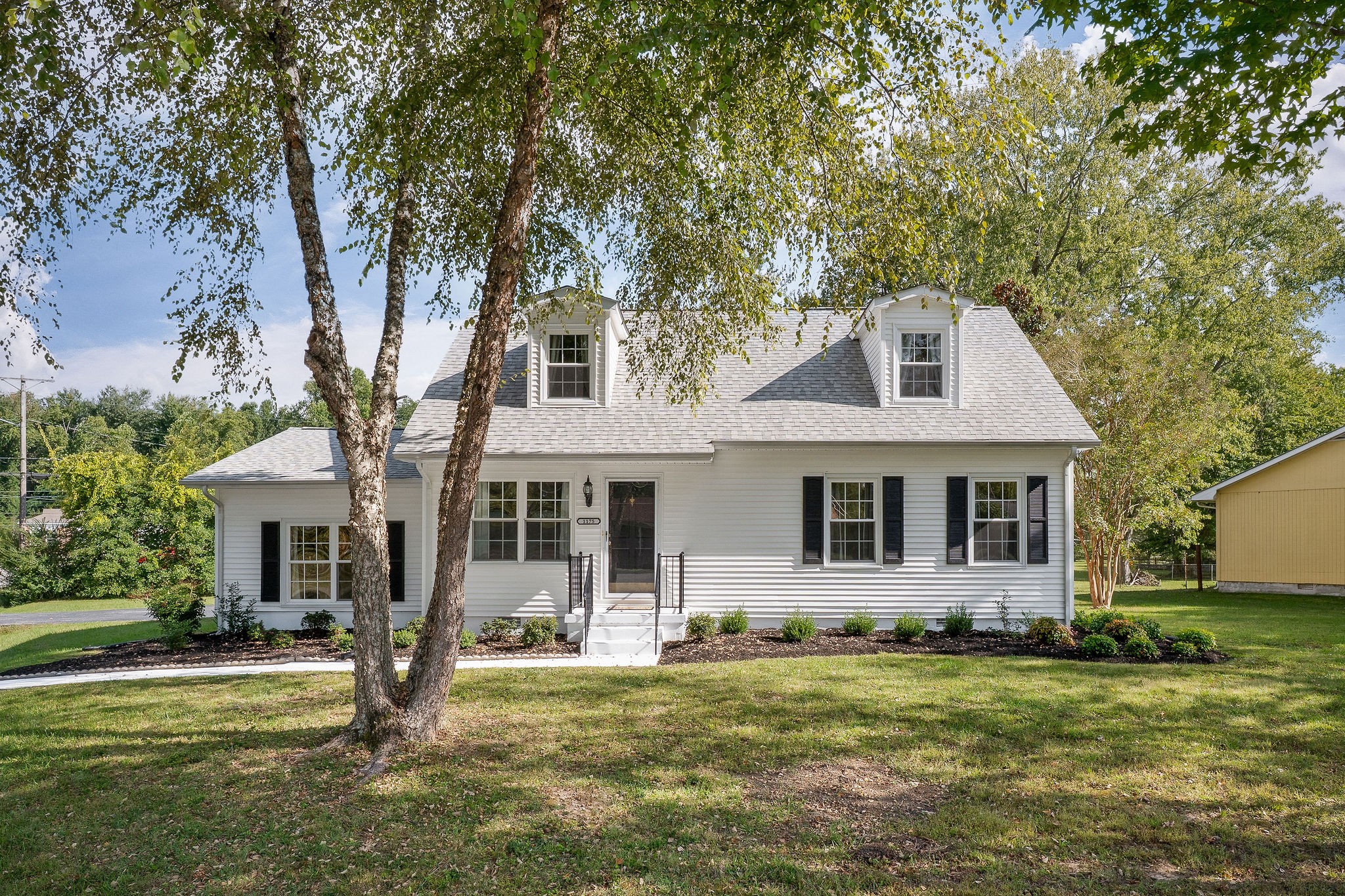 front view of a house with a yard