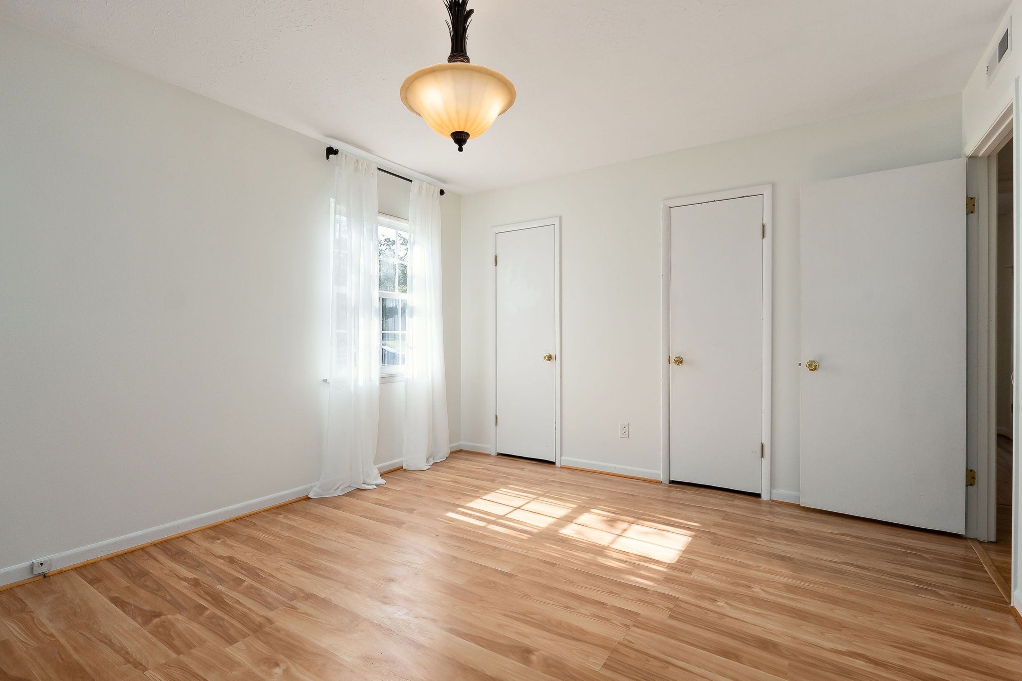 1175 Meadow Road Cookeville, TN 38501 - Photo 21 of 37 a view of empty room with wooden floor and fan