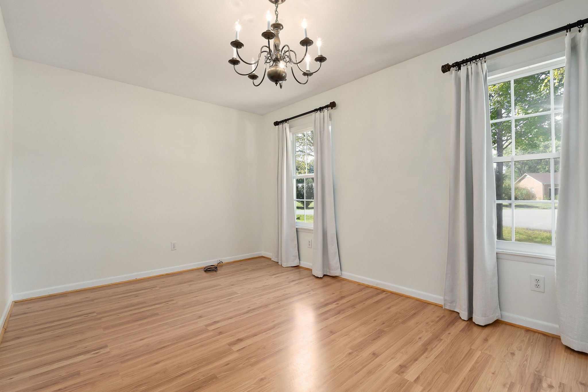 1175 Meadow Road Cookeville, TN 38501 - Photo 22 of 37 a view of an empty room with wooden floor and a window