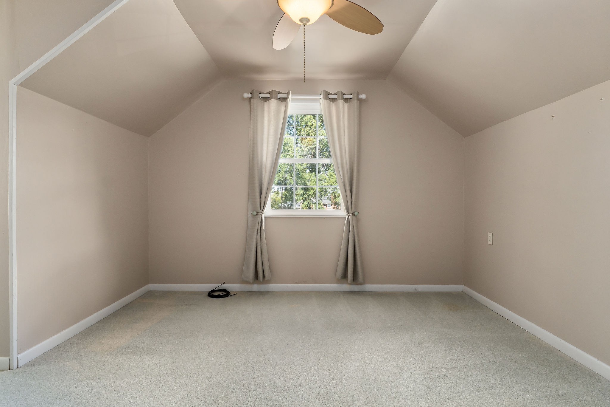 1175 Meadow Road Cookeville, TN 38501 - Photo 25 of 37 an empty room with a window and a ceiling fan
