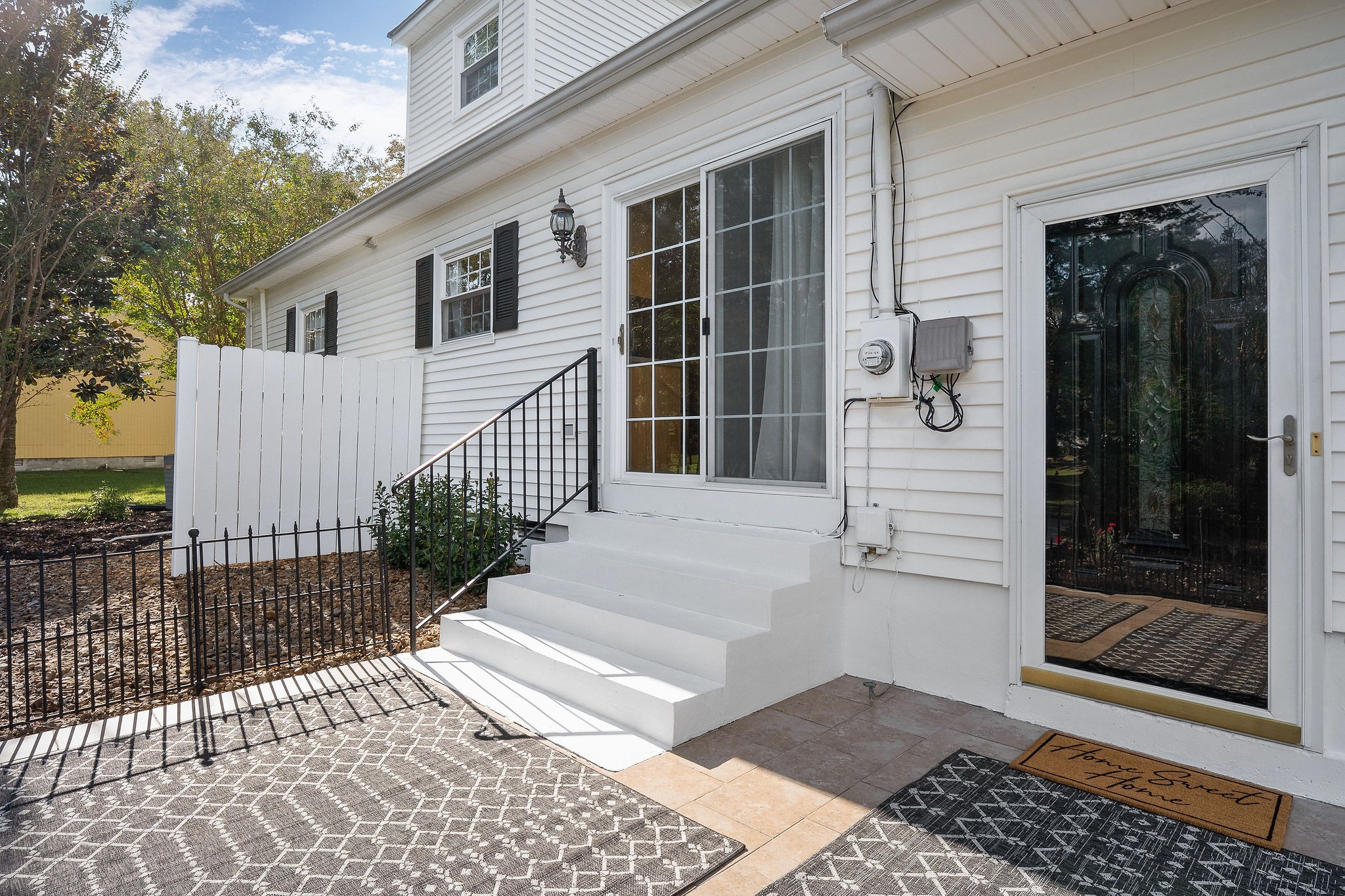 1175 Meadow Road Cookeville, TN 38501 - Photo 33 of 37 a view of a house with a small yard and wooden floor and fence