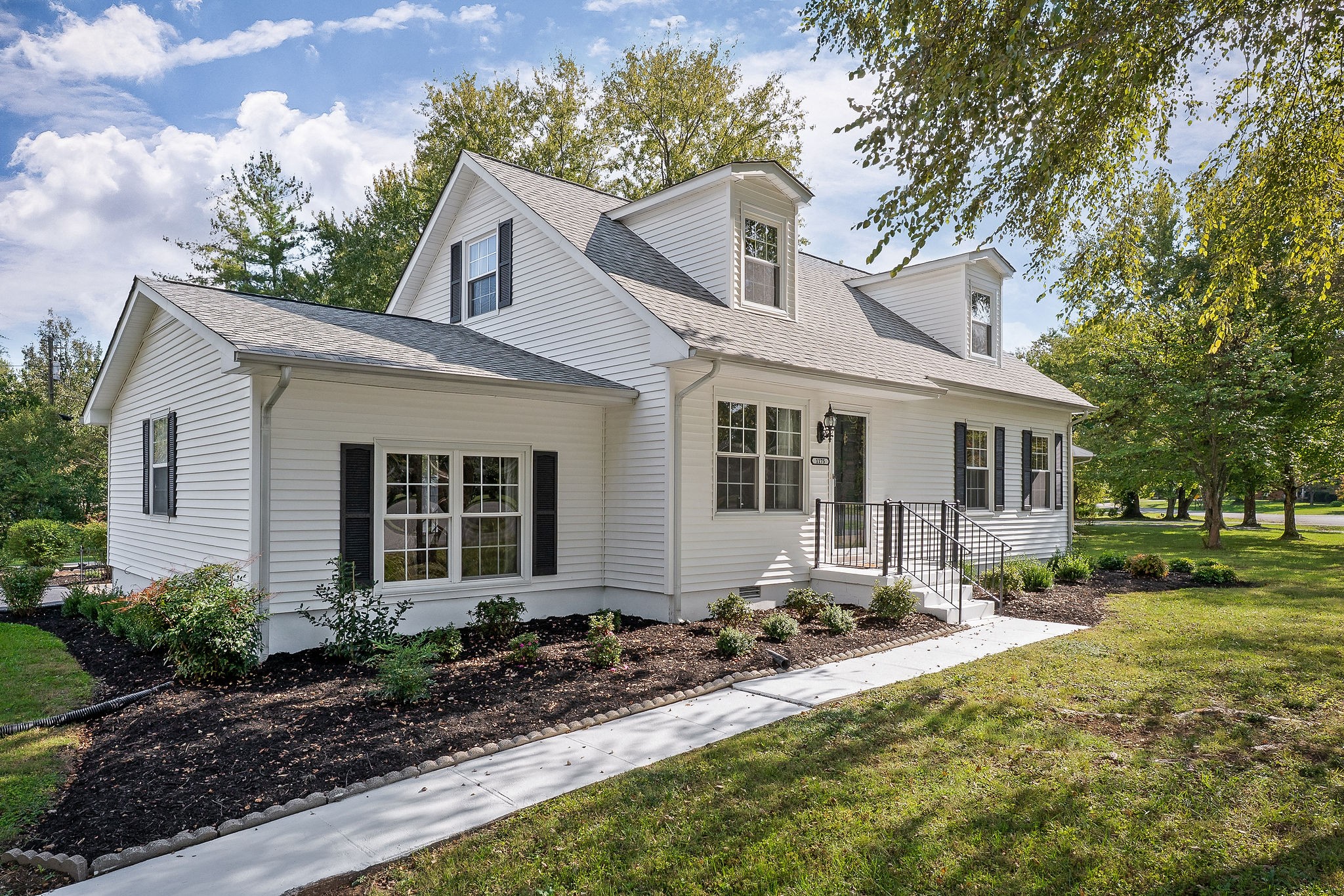 1175 Meadow Road Cookeville, TN 38501 - Photo 35 of 37 a front view of a house with a yard and trees