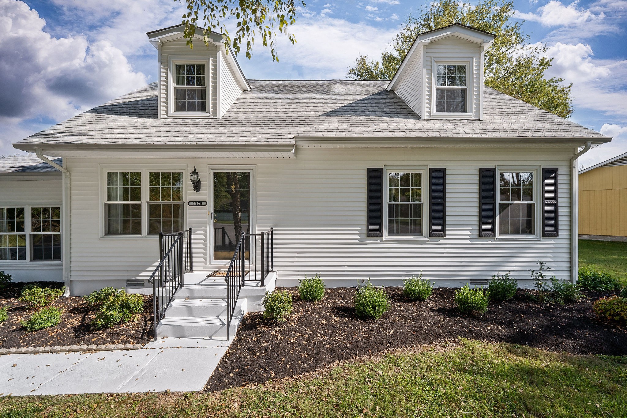 1175 Meadow Road Cookeville, TN 38501 - Photo 37 of 37 a front view of a house with garden