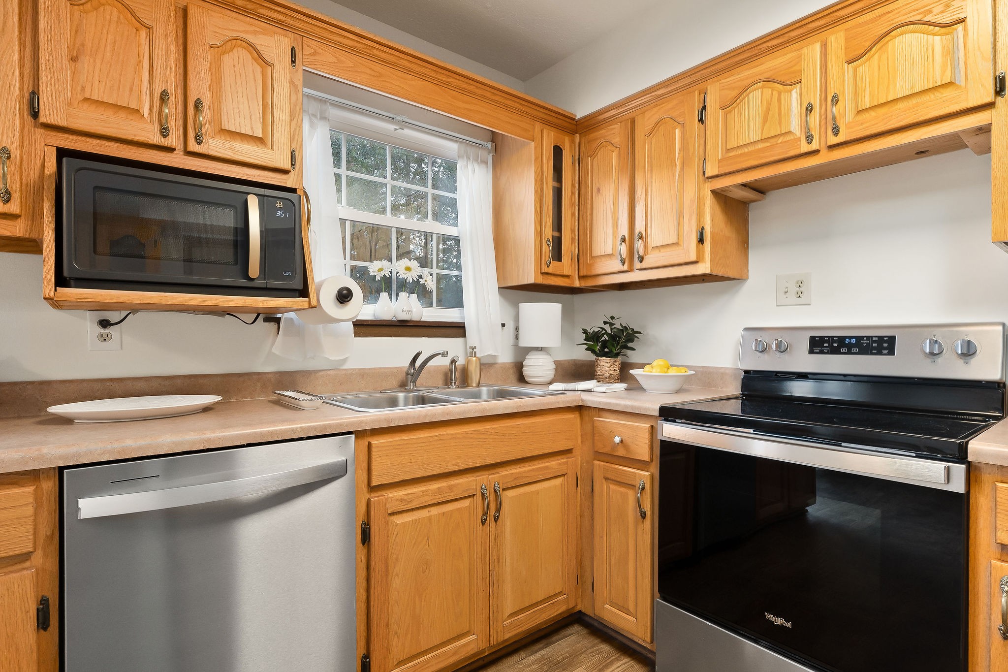 1175 Meadow Road Cookeville, TN 38501 - Photo 8 of 37 a kitchen with stainless steel appliances granite countertop a sink stove and microwave